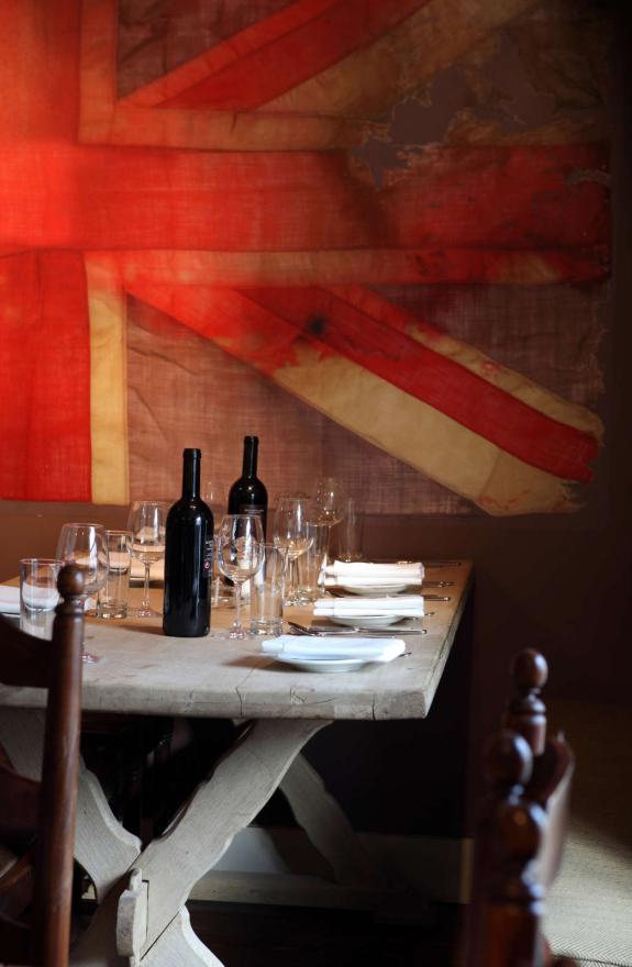 Dining table with large union jack flag in the background